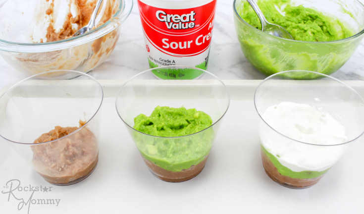 Mexican Bean Dip Cups - beans, guacamole and sour cream layered in cups