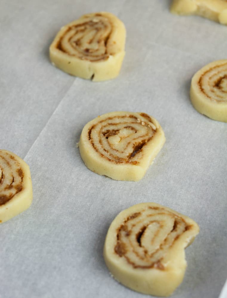 Cinnamon Bun Cookies - sliced cookies on baking sheet