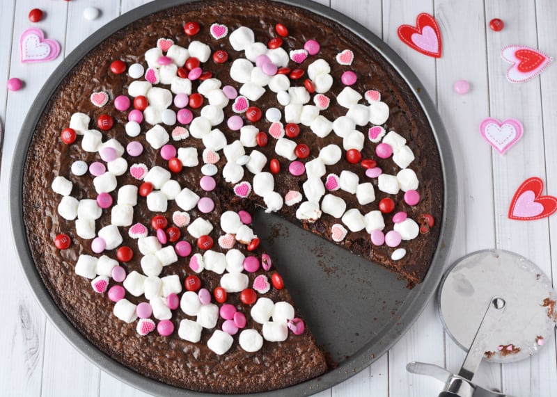Valentines Day Brownie Pizza - brownie pizza with piece cut out