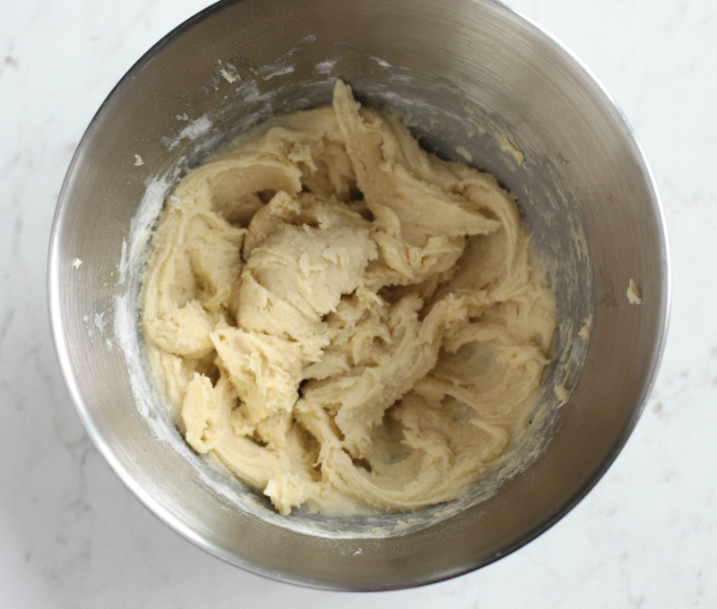 Cookie batter mixed in a stand mixer
