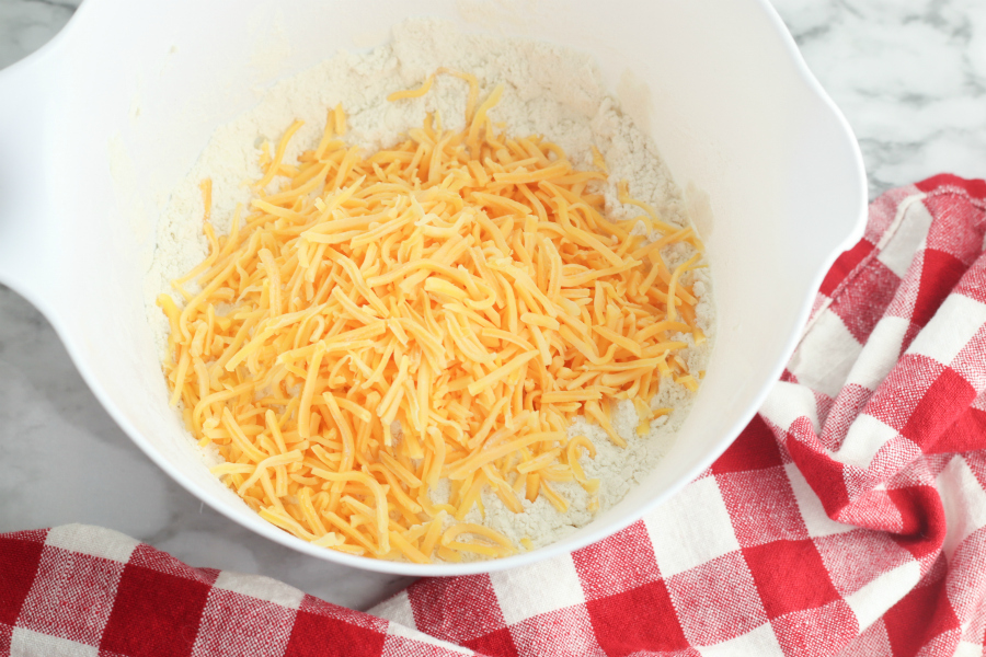  shredded cheddar cheese added to the mixing bowl