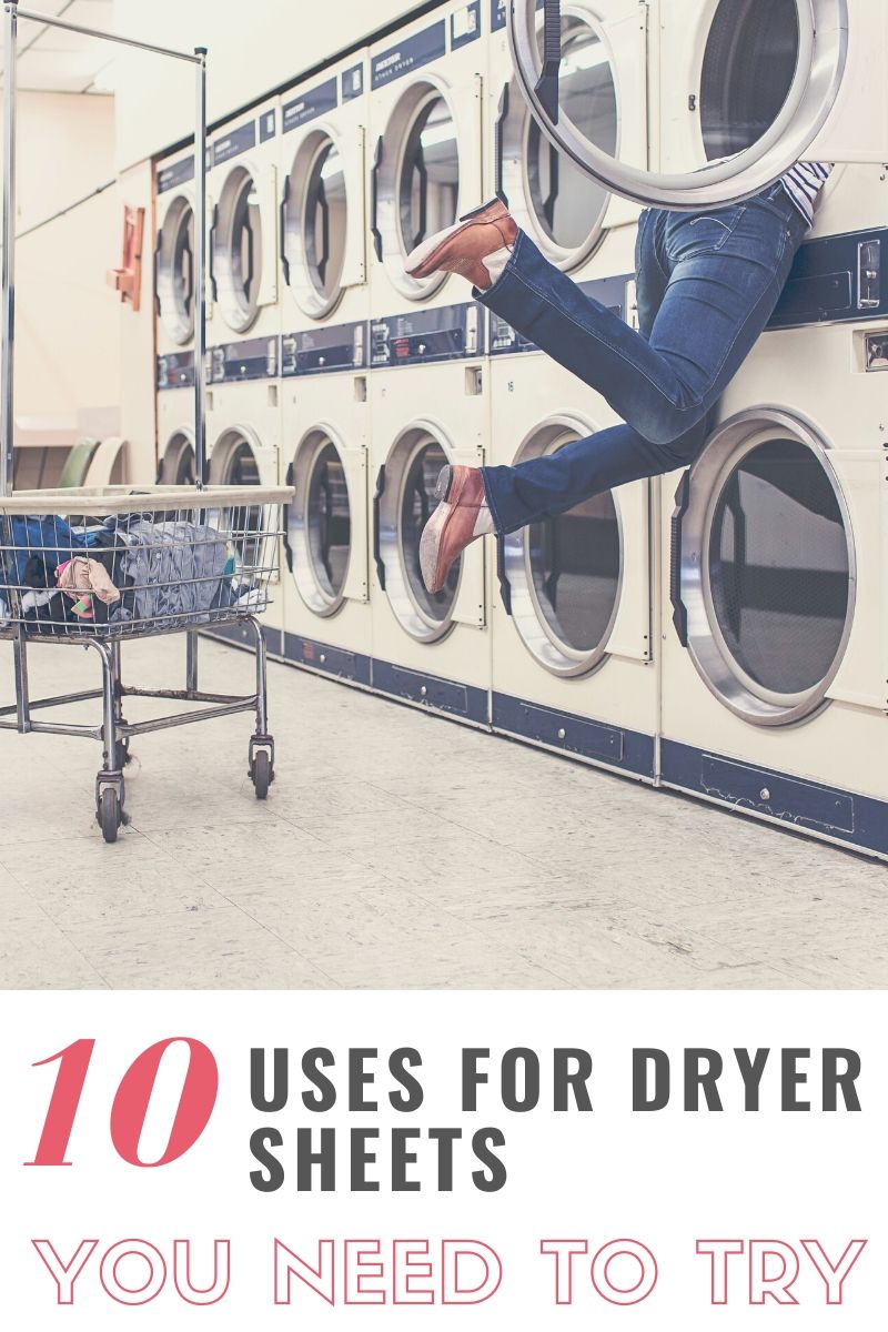 image of a laundry mat, with a person crawling into a dryer