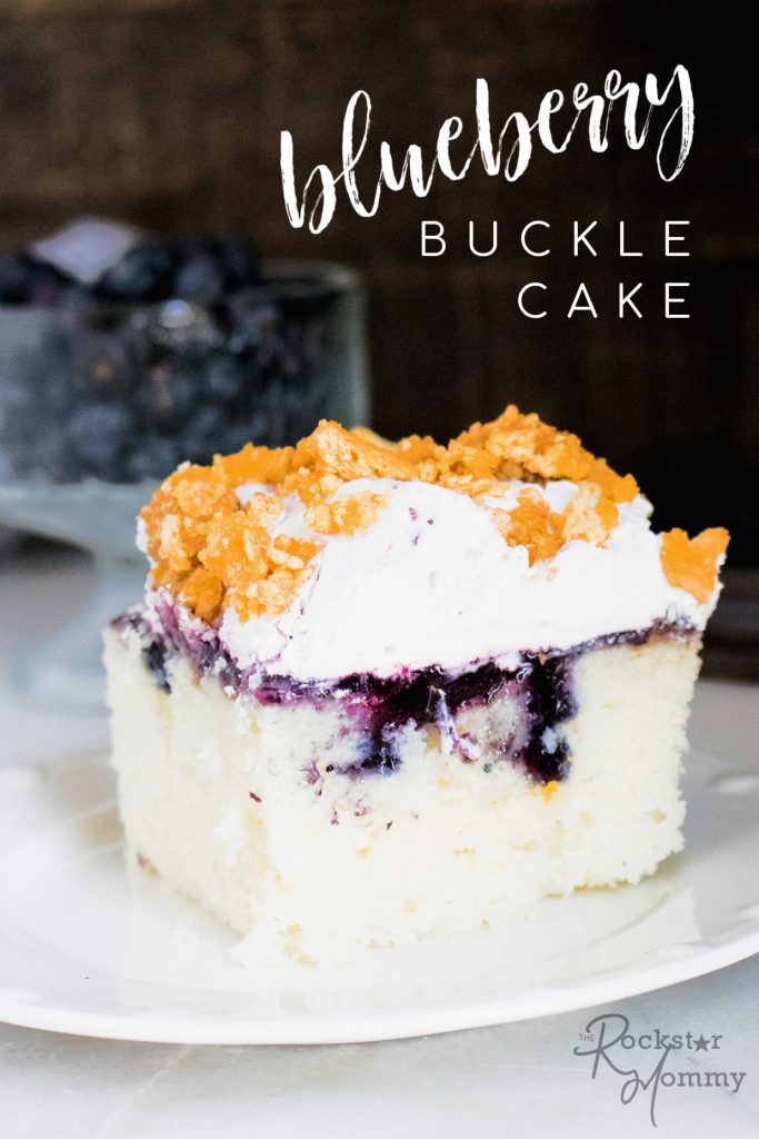Blueberry Buckle Poke Cake Recipe - piece of cake on a white plate