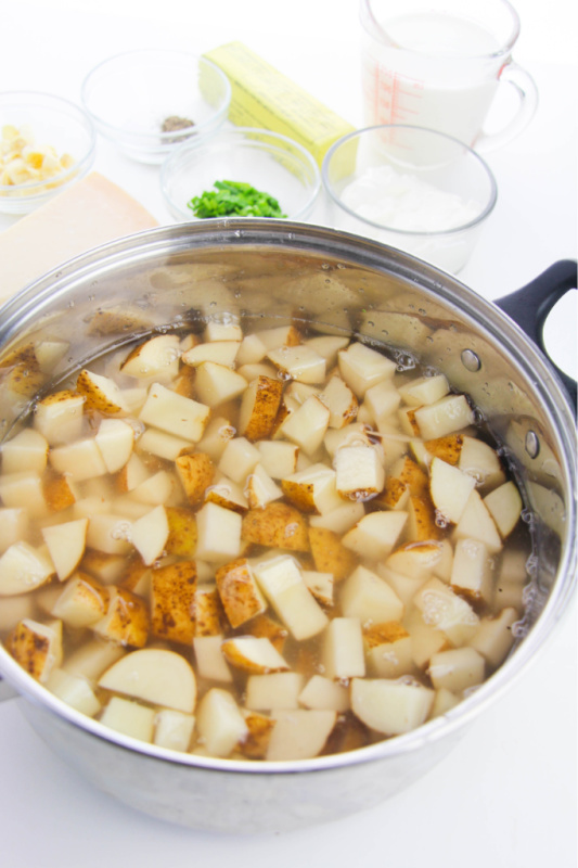 diced potatoes covered in water in a large pot