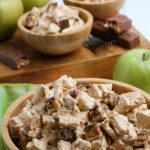 Apple snickers salad in wooden bowls
