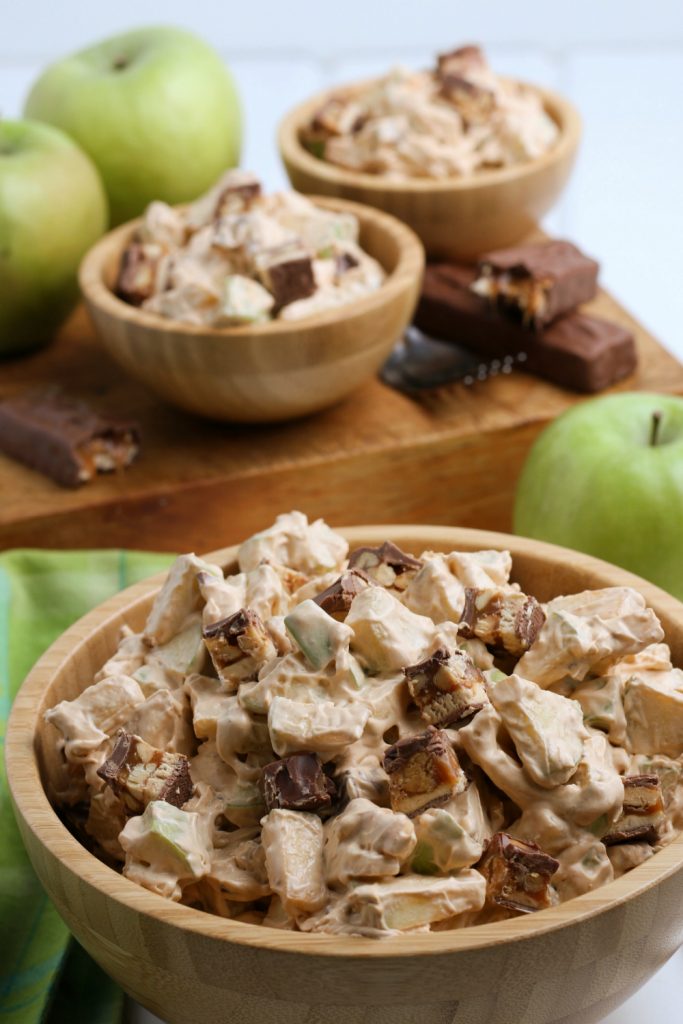 Apple snickers salad in wooden bowls