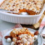 Sweet Potato Casserole served on a stack of plates