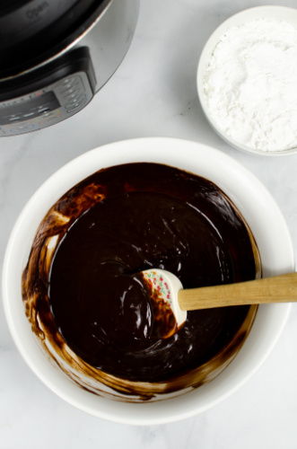 stirring melted chocolate with a spatula