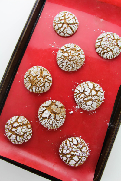 Gingerbread crinkle cookies on a baking sheet