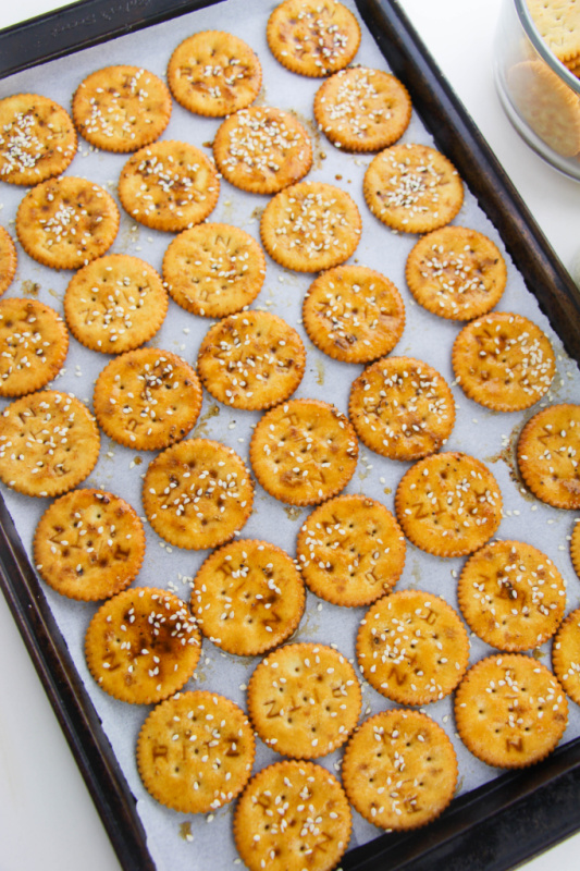 crackers spread out on a baking sheet