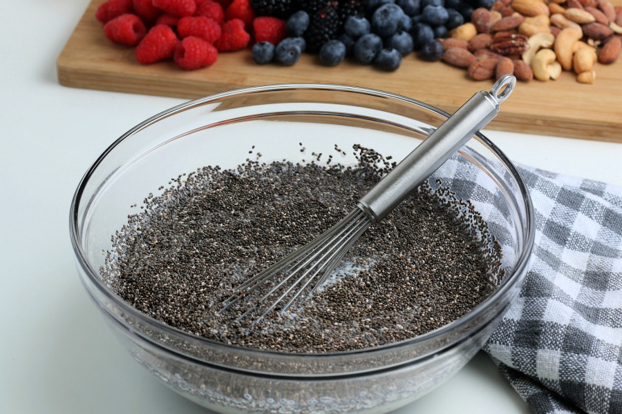 mixing ingredients for chia pudding in a mixing bowl