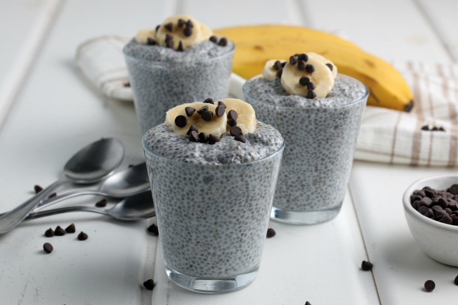3 cups of chia pudding topped with sliced bananas and chocolate chips