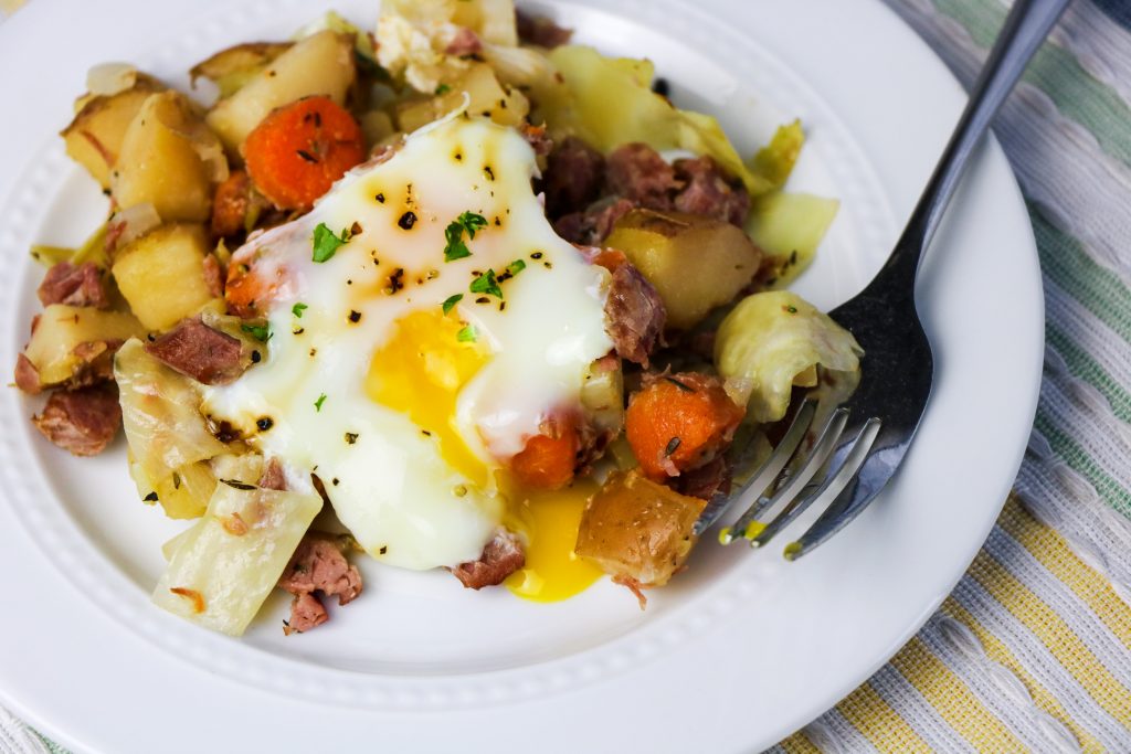 serving of corned beef and cabbage breakfast hash on 
