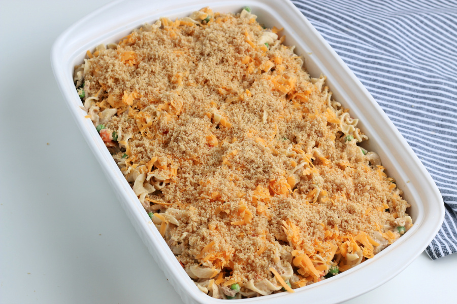 shredded cheese and bread crumble on top of casserole