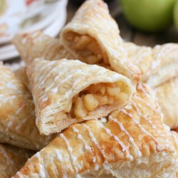 apple turnovers stacked on a plate