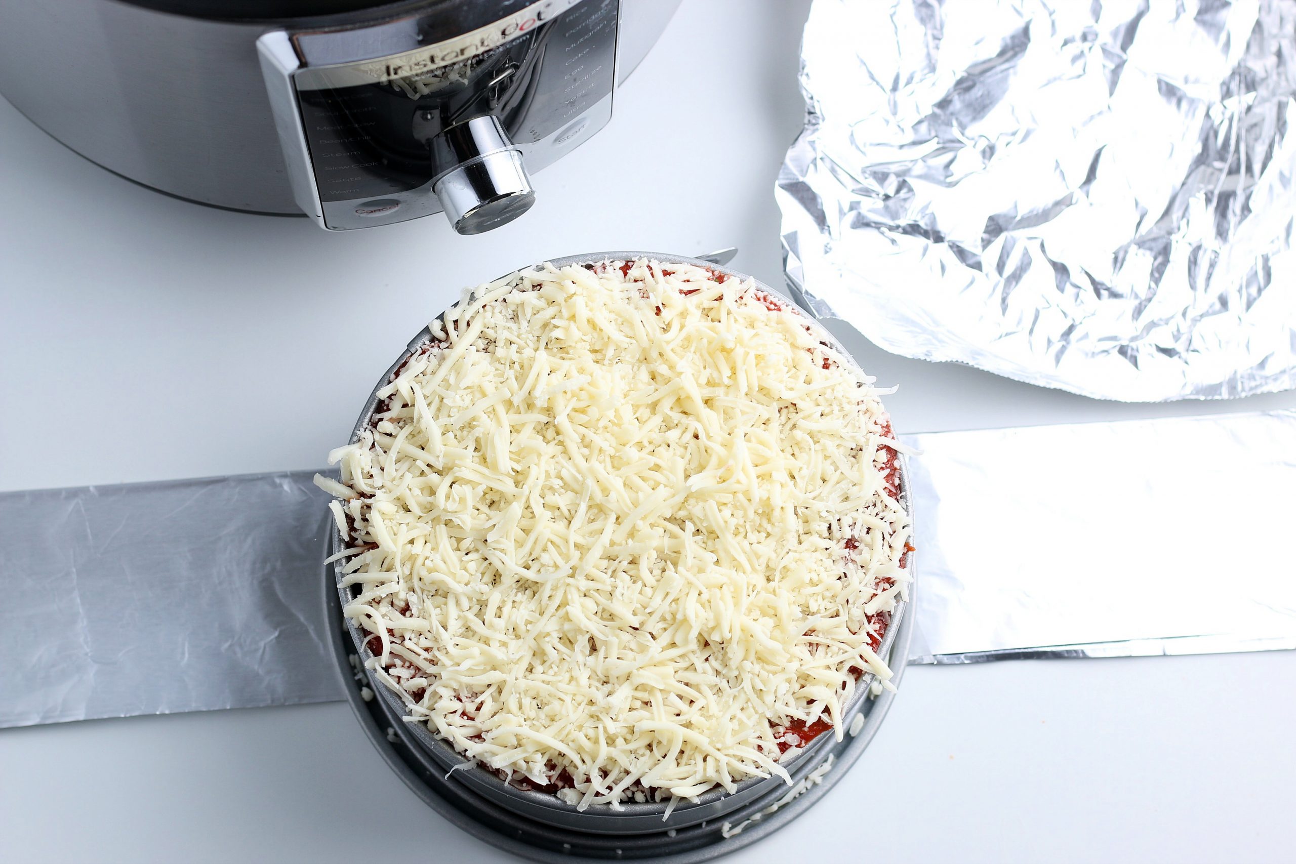 complete uncooked lasagna in springform pan