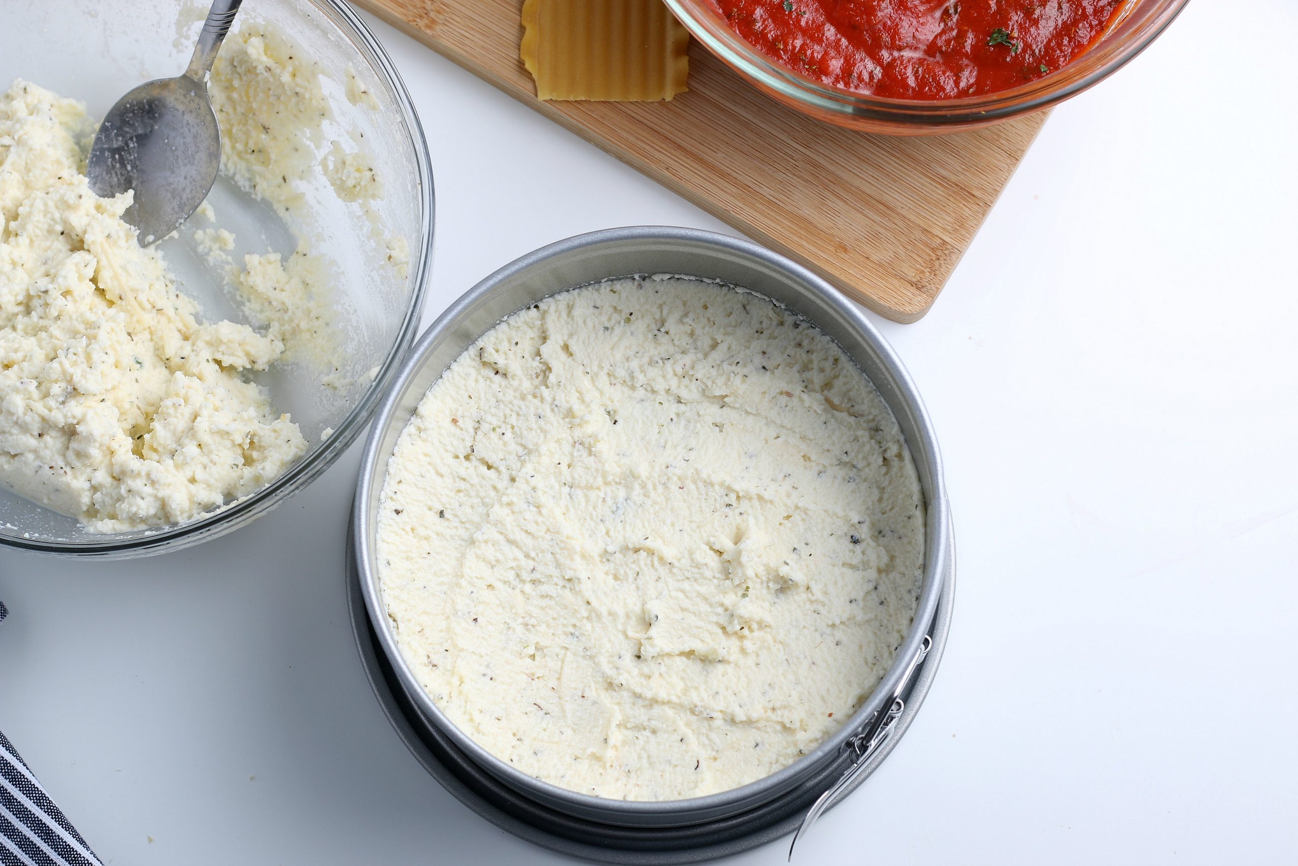 ricotta cheese mixture spread on top of noodles