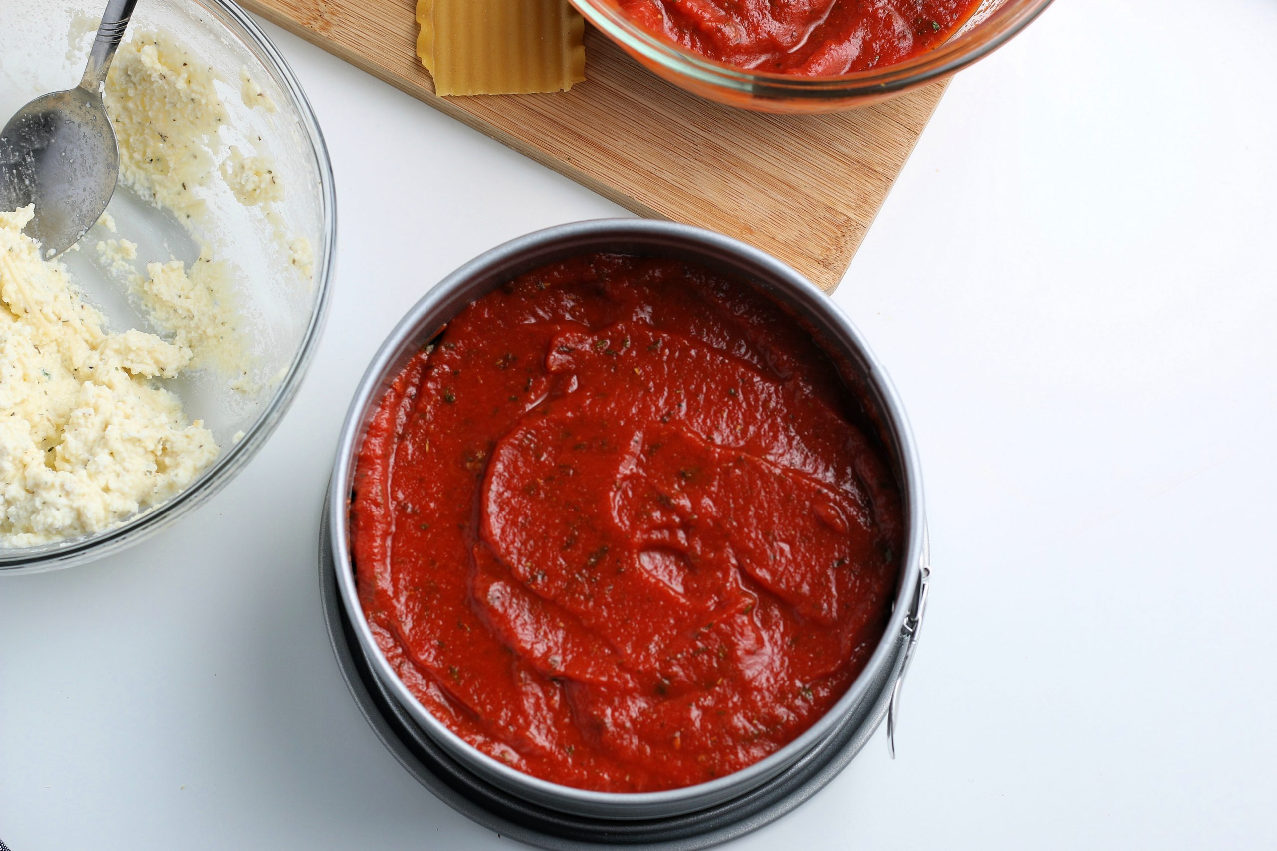 red sauce placed on top of meat mixture