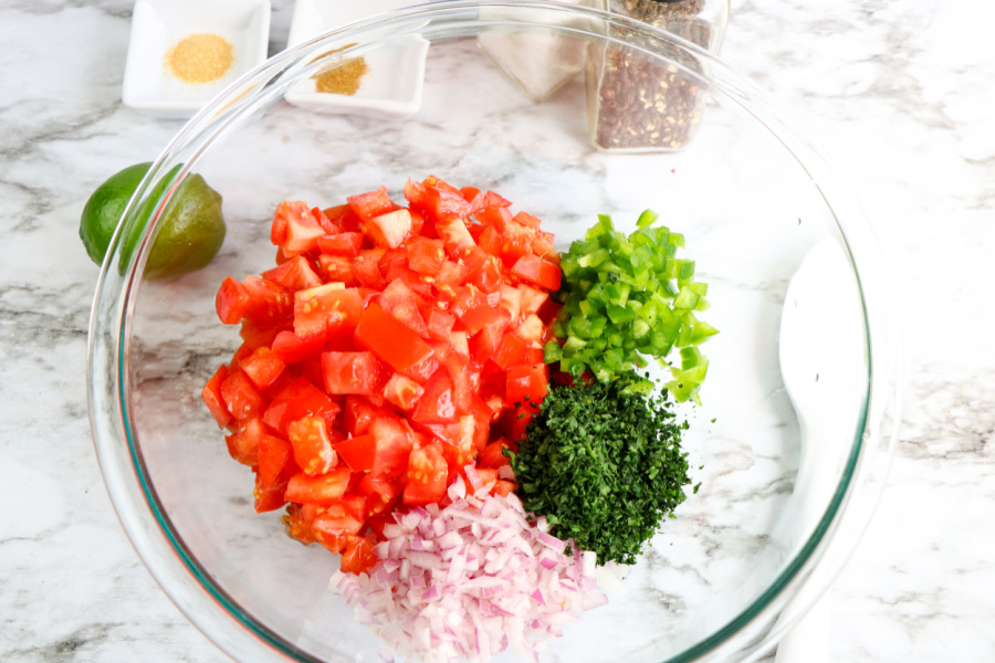 ingredients for pico de gallo in a large mixing bowl