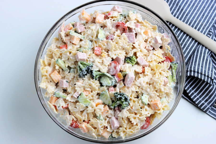 Summer Bowtie Pasta Salad in a large mixing bowl
