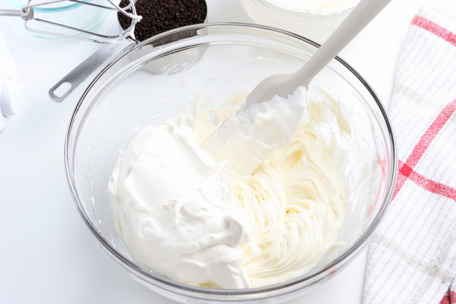 folding whipped cream topping into mixture