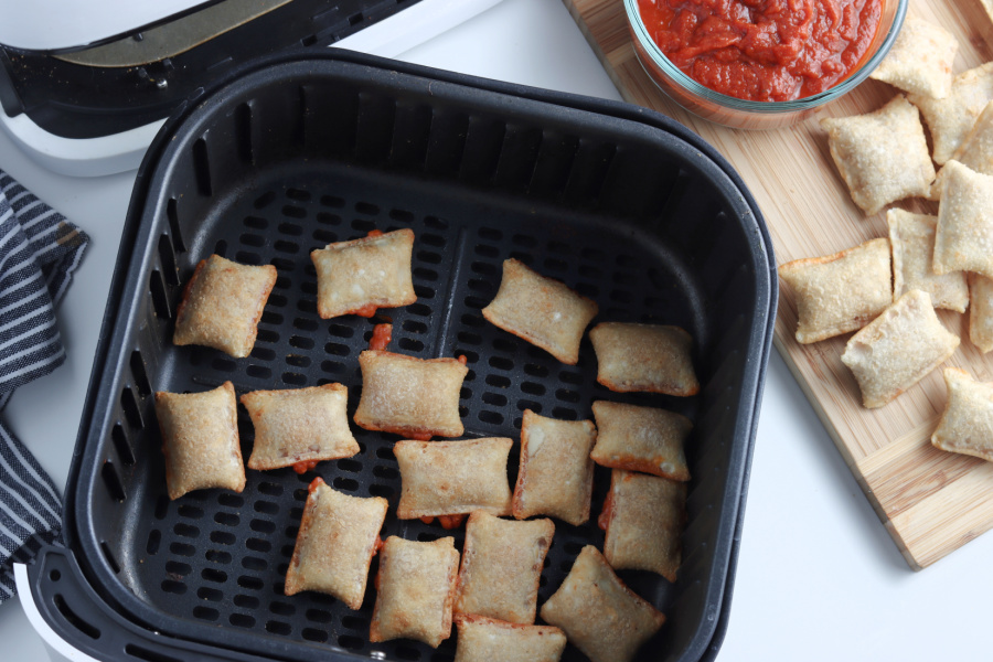 cooked pizza rolls in air fryer basket