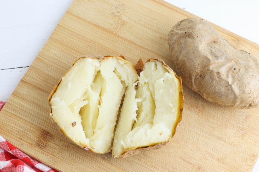 cooked baked potato cut in half