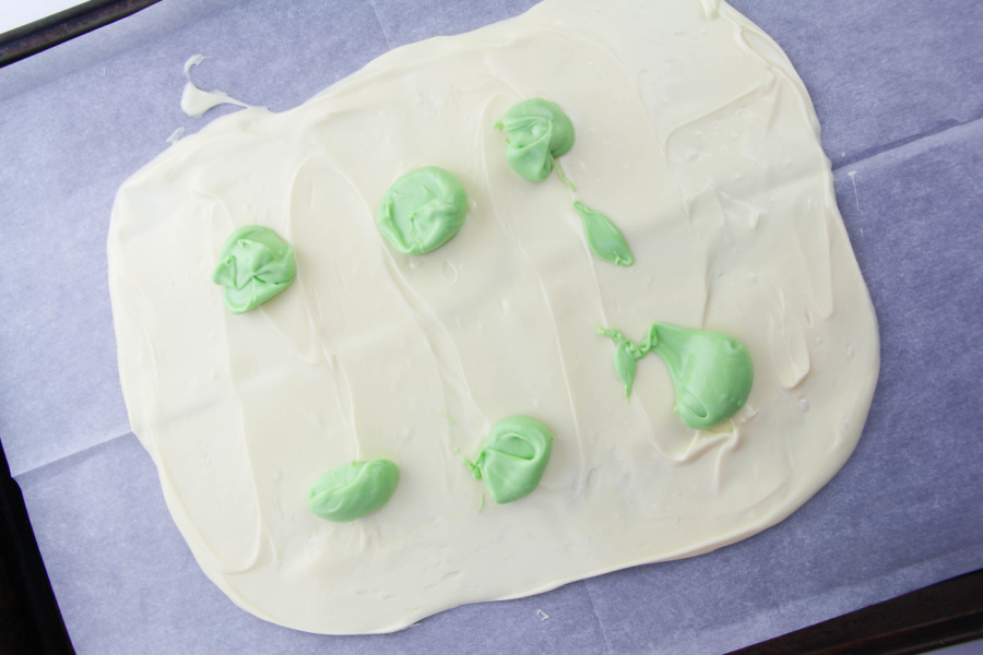 green melts added on top of white chocolate
