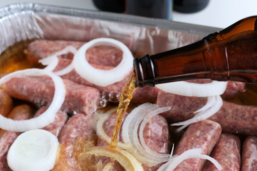 pouring beer over brats