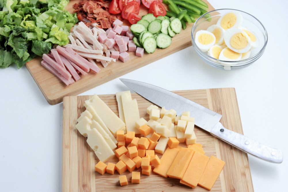 chop salad ingredients on cutting board