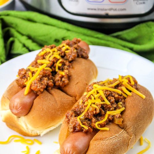 two chili dogs on a plate