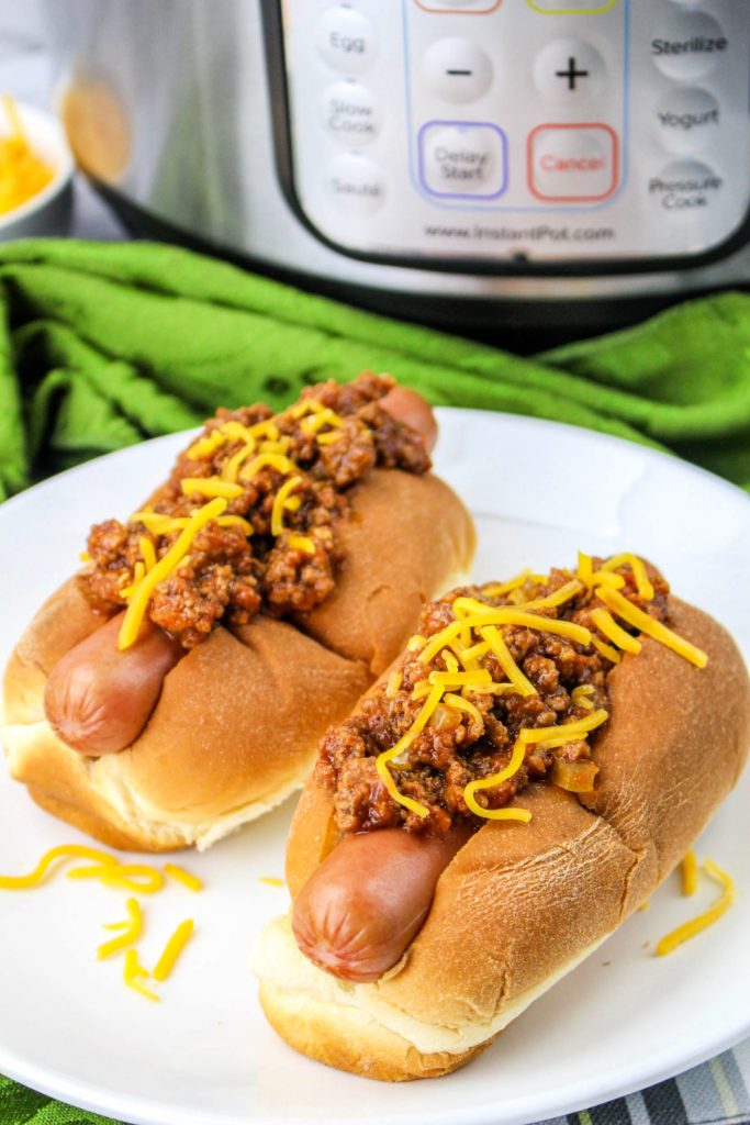 two chili dogs on a plate