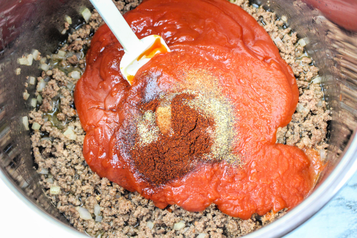 adding sauce and seasoning into pot