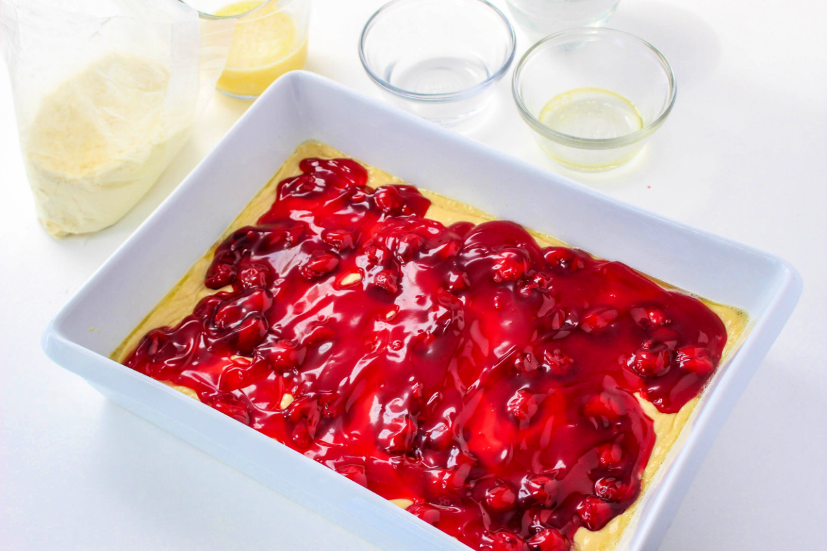 addig cherry pie filling to top of batter