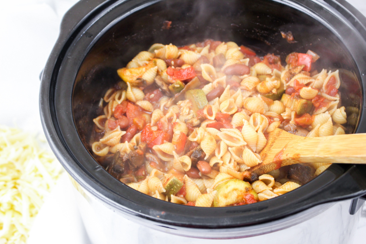 adding pasta to slow cooker mix