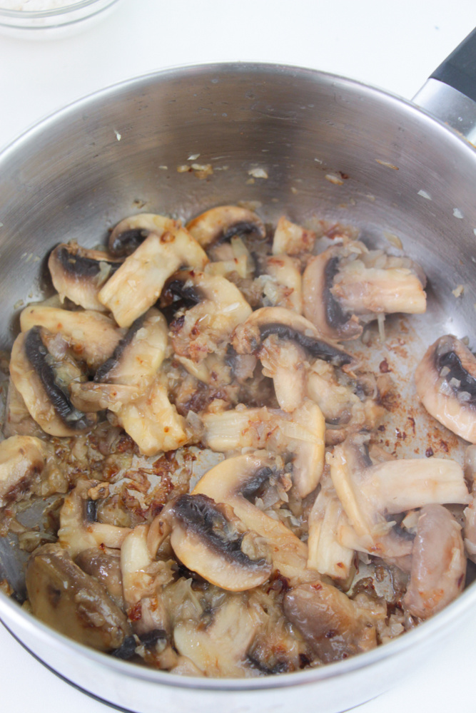 cooked mushrooms and onions in pan