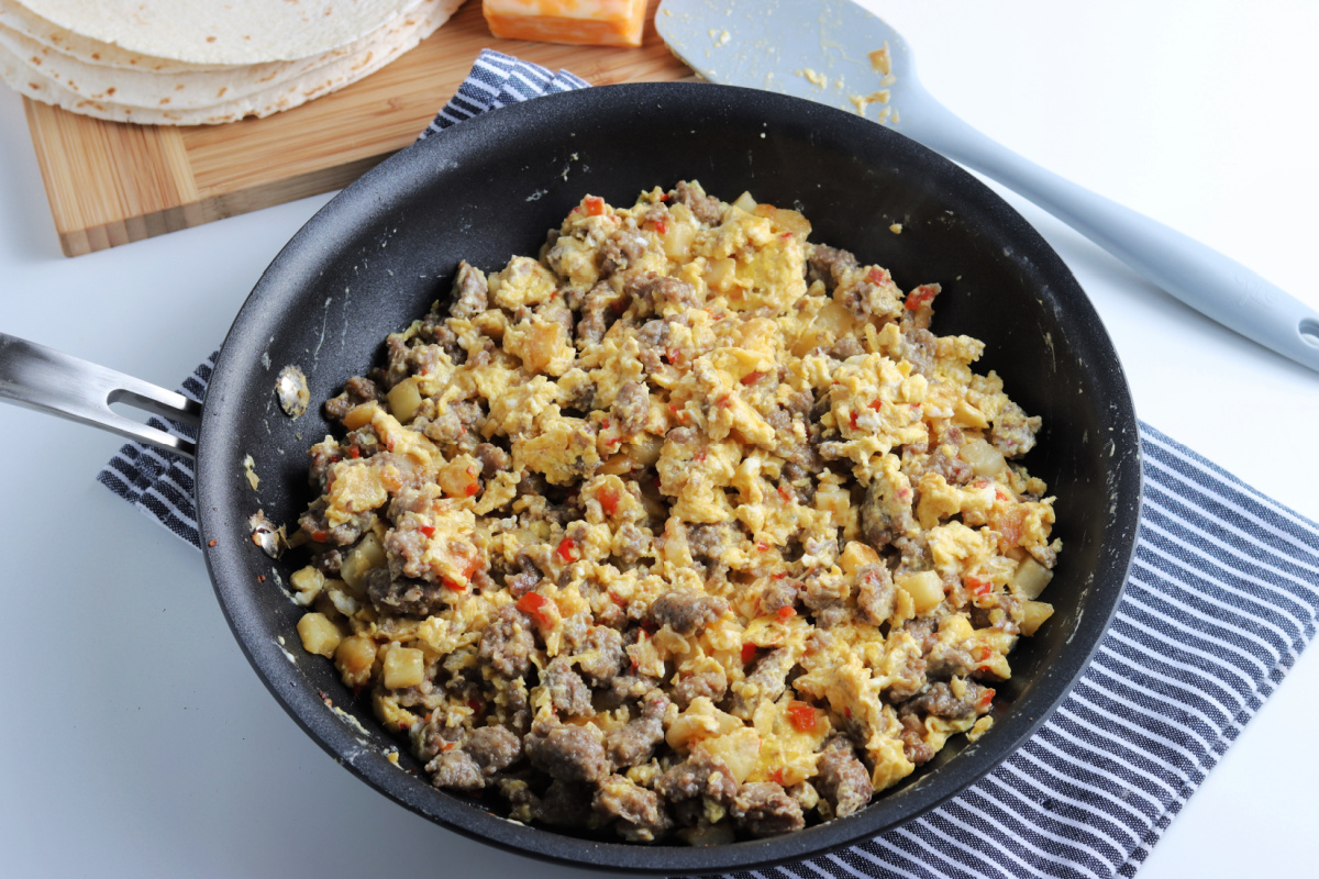 scrambled eggs added to pan