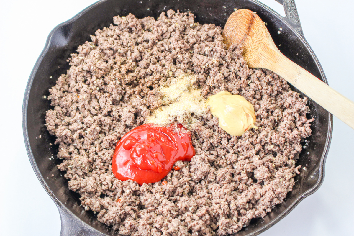 ketchup, mustard, Worcestershire sauce, and garlic powder added to ground beef