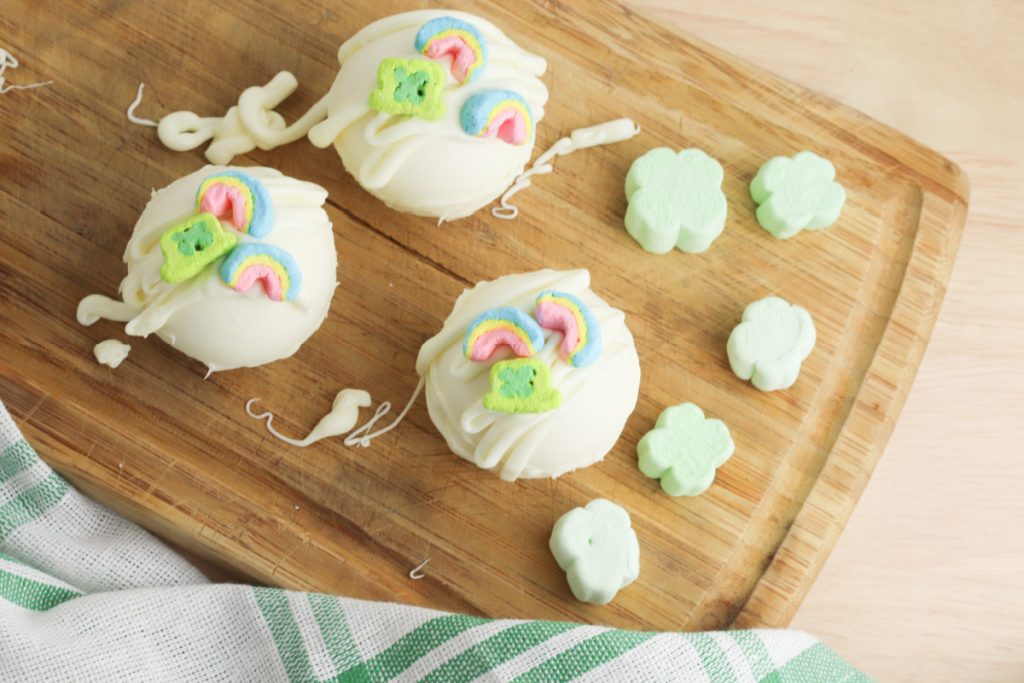 Lucky Charms Hot Chocolate Bombs on a cutting board