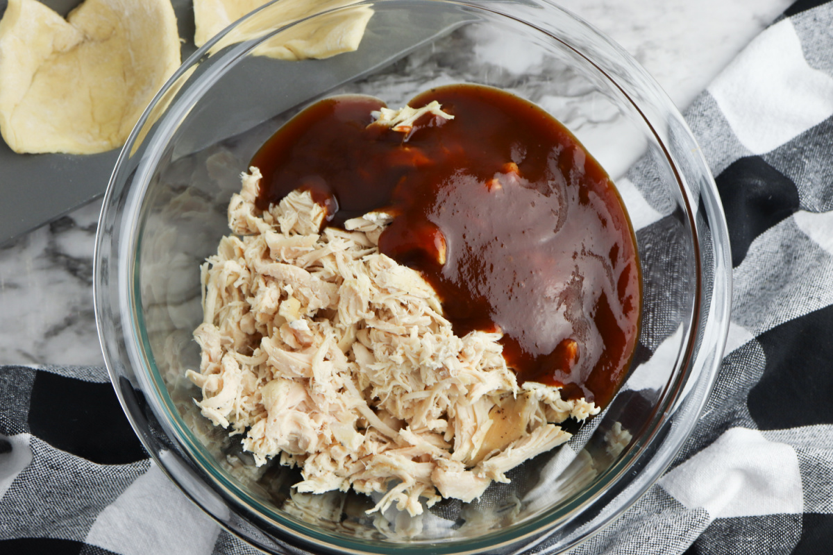shredded chicken and BBQ sauce in a medium bowl