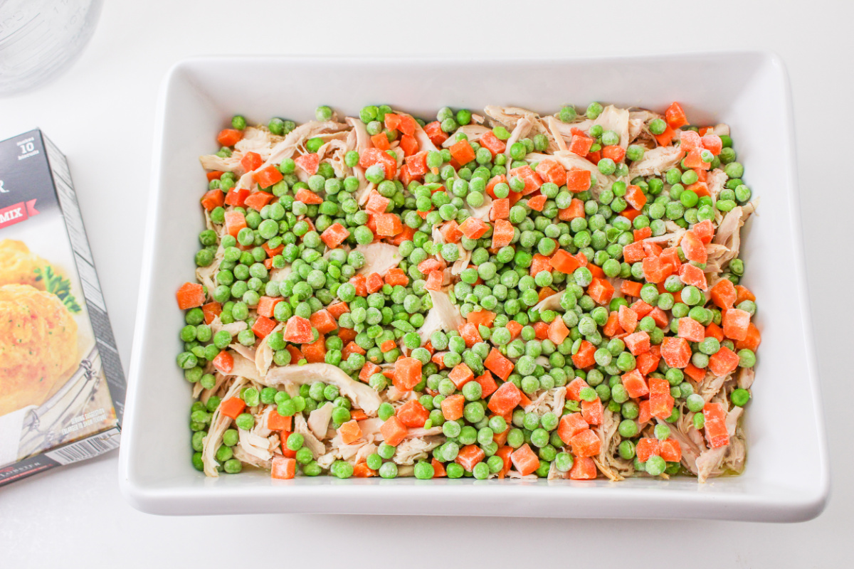 shredded chicken and vegetables added to baking dish