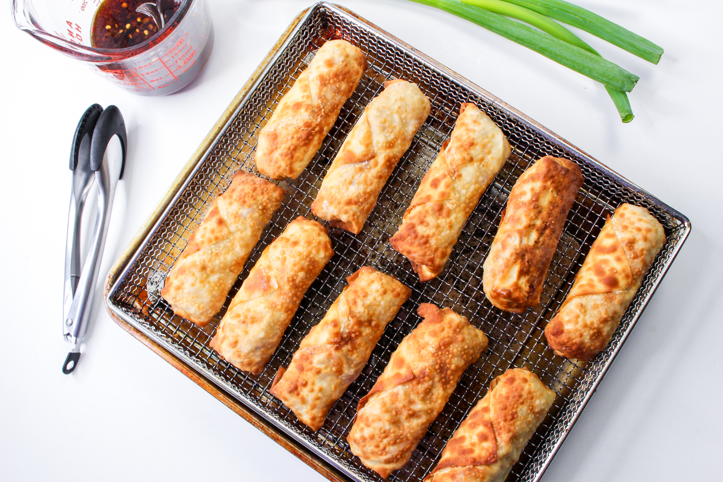 cooked egg rolls on a cooking rack