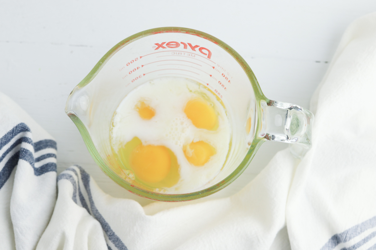 eggs milk as seasoning in mixing bowl