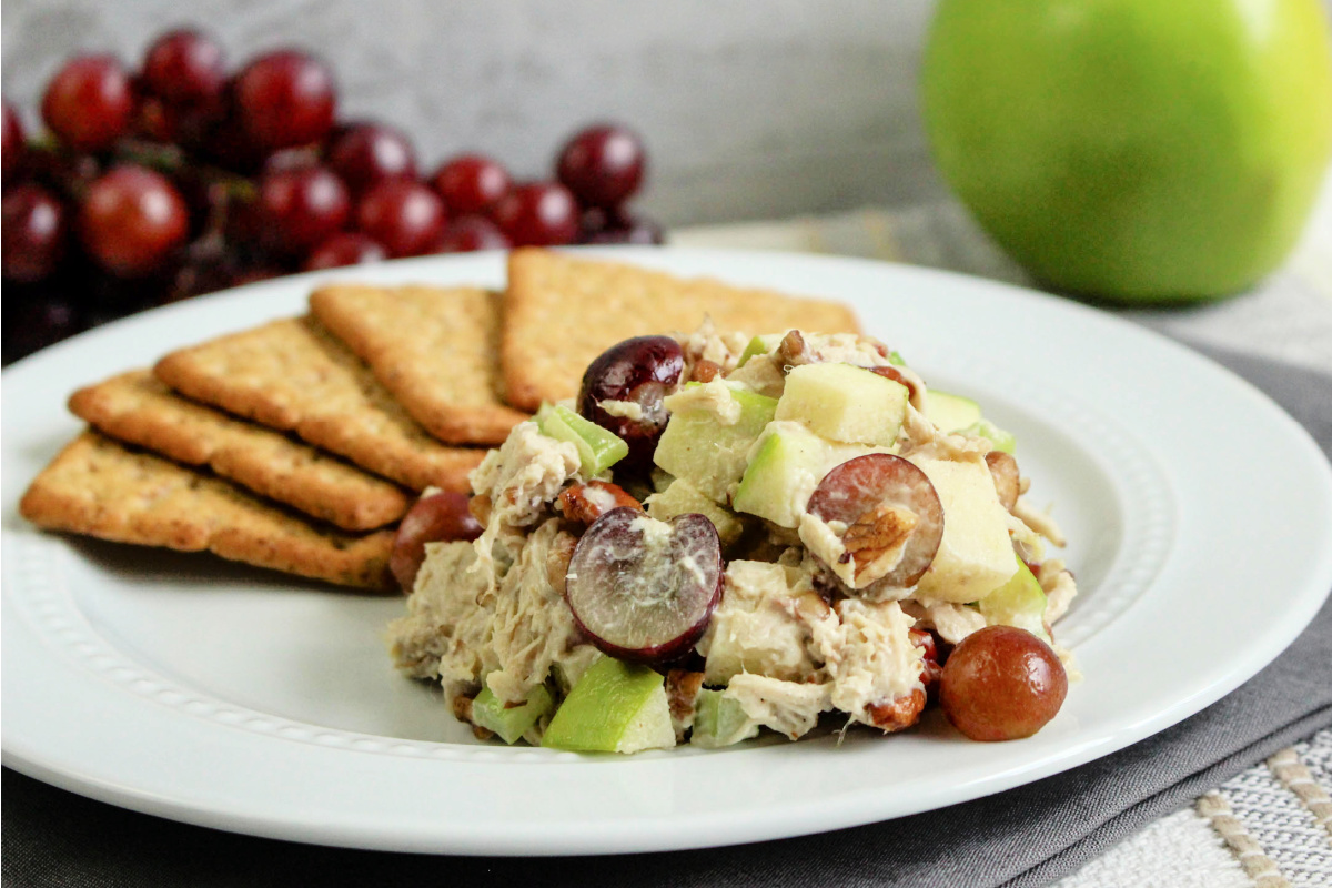 Chicken Salad with Grapes and Apples on a plate with crackers