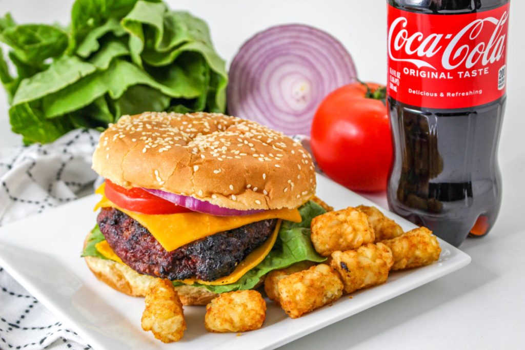 Coca Cola Burger on a plate with tater tots
