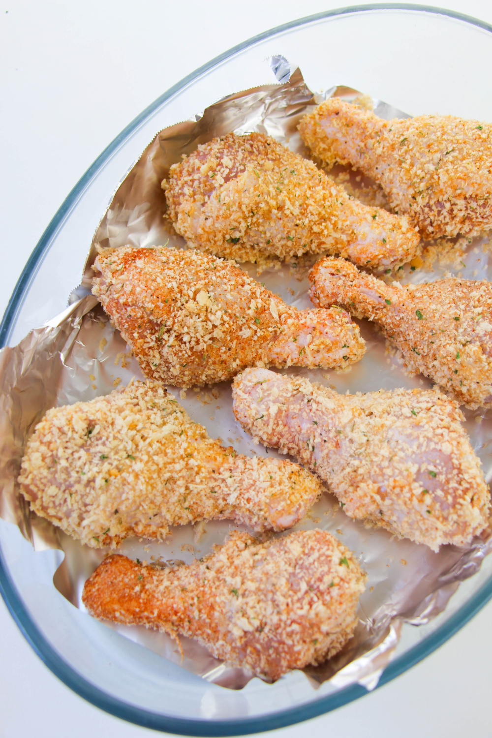 coated chicken in baking dish