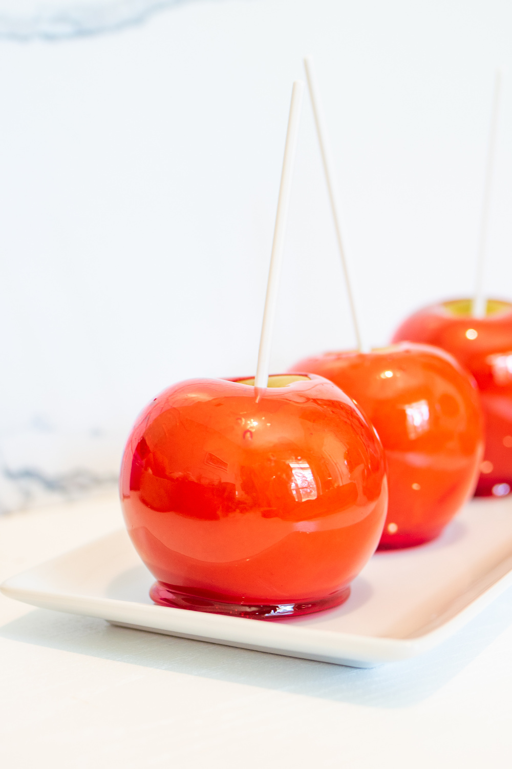 candy apples on a serving platter