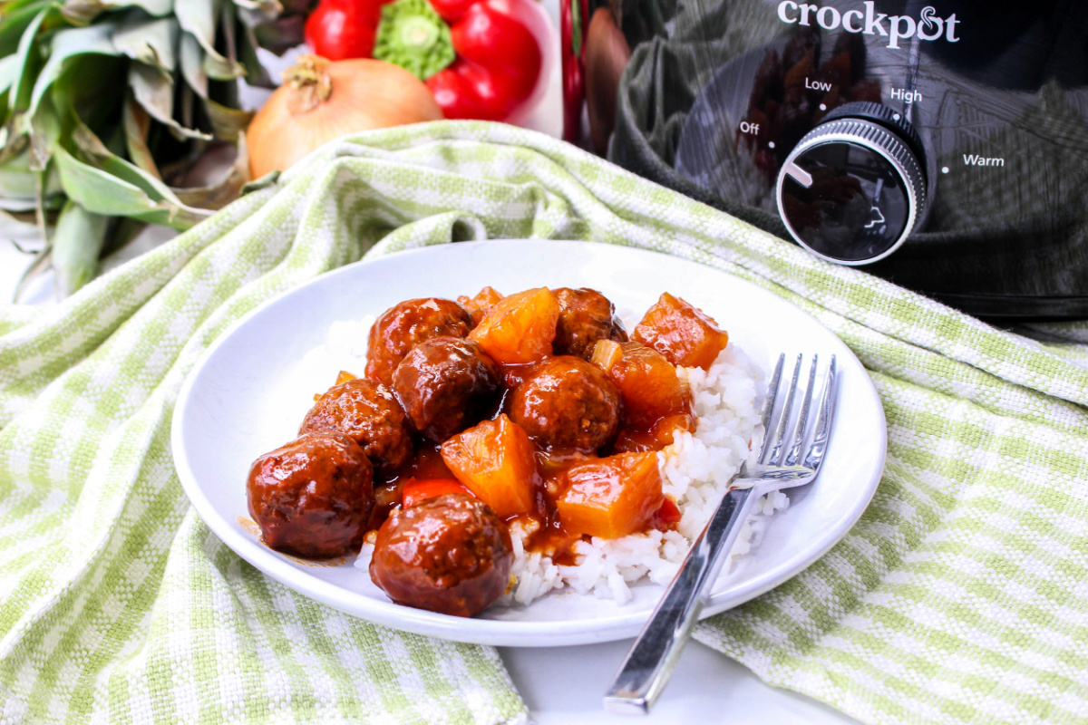 Crockpot Pineapple Barbecue Meatballs on a plate with rice