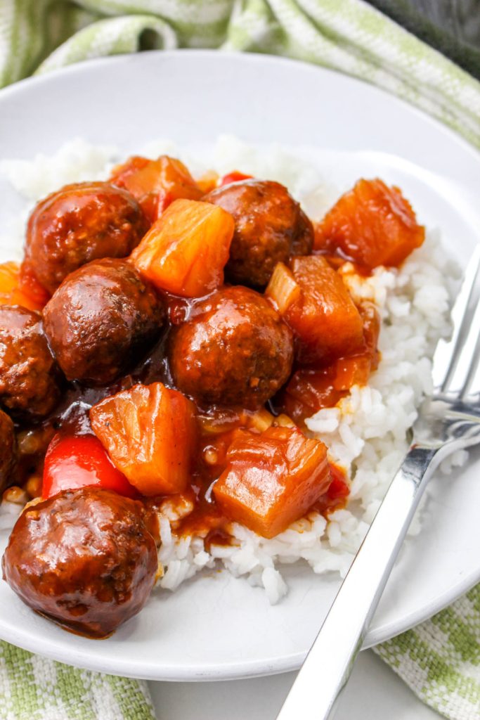 Crockpot Pineapple Barbecue Meatballs on a plate with rice