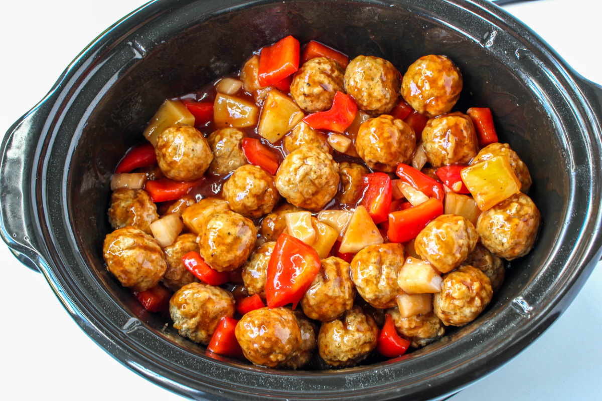 Ingredients for Crockpot Pineapple Barbecue Meatballs in a slow cooker